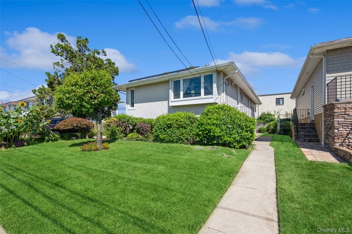 View of home's exterior with a yard