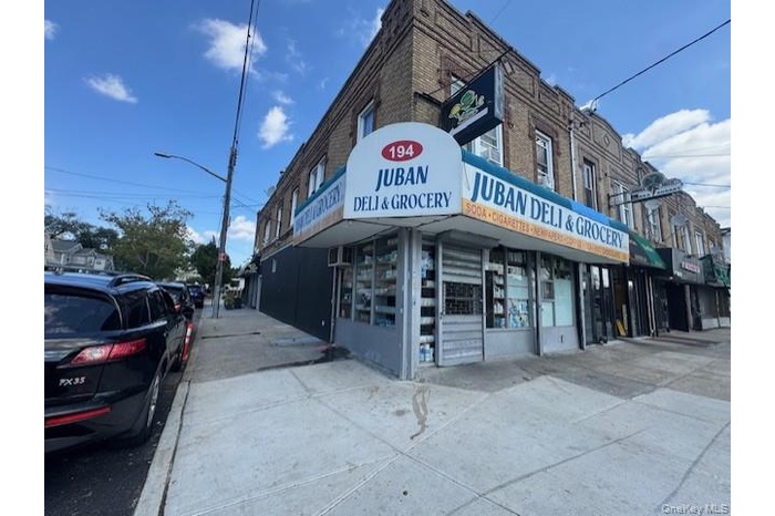 Mix use property for sale. With 2 commercial (bar/grocery/deli) and 2 apartments
