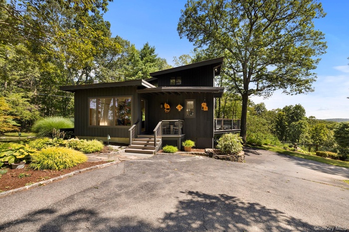 View of front of house with covered porch