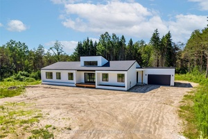 Built in 2024, this stunning modern home sits on 47 acres of natural beauty, offering the perfect blend of privacy, space, and sleek design.