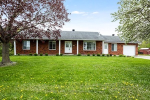 Attractive, curb appeal, brick bungalow with attached single garage plus, detached garage workshop.