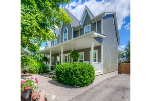 Fronting onto a charming treed boulevard and backing onto peaceful natural surroundings and open farmers fields, this home offers the perfect blend of privacy and community.