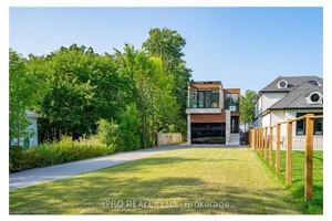 Welcome to 6 Campview Road a truly exceptional waterfront estate offering luxury, privacy, and rare direct access to the shores of Lake Ontario.
