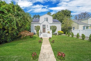 Nestled in a serene, tree lined neighborhood, this Beautiful, bright and spacious cape is in the heart of Huntington.
