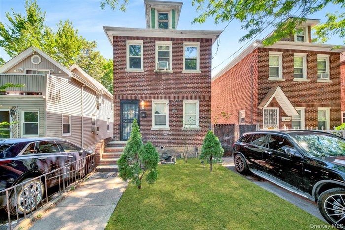 View of front of home with brick siding