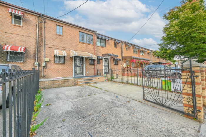 Rear view of property featuring brick siding