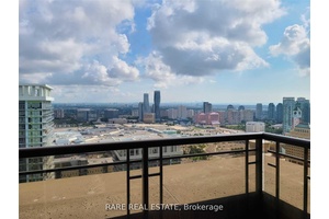 Enjoy The Stunning Views Of Toronto And The Lake From This Clean And Well Laid Out 1 Den, 2 Full Bath Condo.