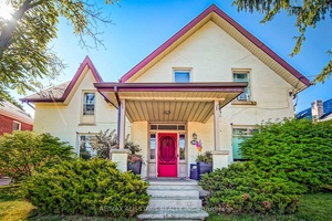 Nestled on a spacious and private 66 x 165 lot, this all brick two storey legal duplex with an additional 600 sq.