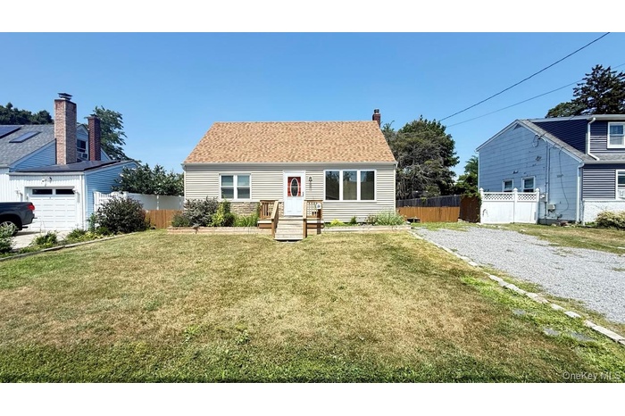 View of front of property with roof with shingles and a chimney