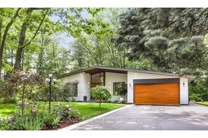 Modern luxury renovated bungalow on a massive, third of an acre pie shaped lot, backing into a park.