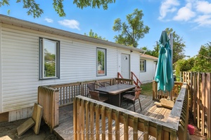 Welcome to this beautifully updated mobile home in Bellwood Estates, a quiet and well maintained community in the heart of Bells Corners.