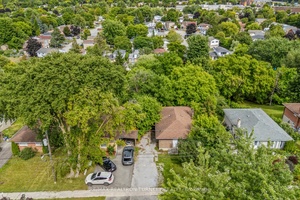 Spacious, Detached Brick Bungalow nestled on a Premium Ravine Lot 50 x 150' with Separate Entrance to Bright Walk Out basement !