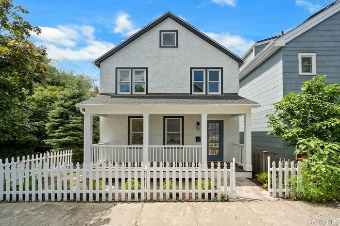 View of front of house with covered porch