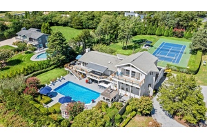 Welcome to 49 Tuthill Lane, a haven of resort style living nestled in the heart of Remsenburg, NY.