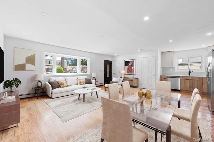 Dining space featuring light wood finished floors, recessed lighting, and baseboard heating