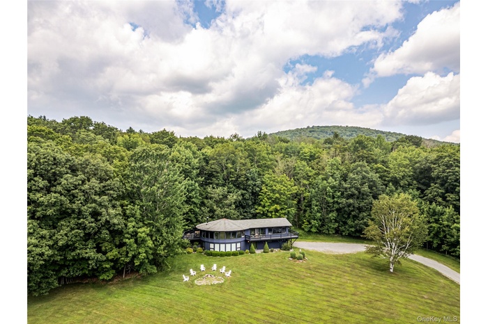 View of subject property with a heavily wooded area