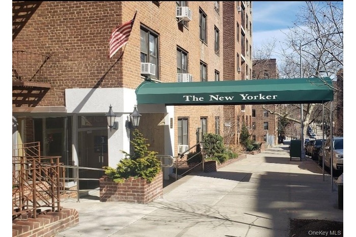 View of building exterior with cooling unit
