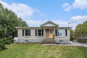 Tucked away on a serene, beautifully landscaped half acre lot, this fully renovated bungalow offers the perfect blend of modern sophistication and warm country charm just minutes from all the ...