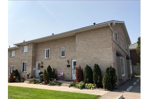 Exceptional well dressed end unit with an abundance of extra windows on a quiet location in the complex at White Hills.