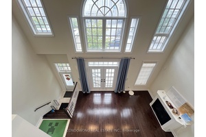 Luxurious end unit freehold townhome, featuring a private elevator and an expansive 400 sq.
