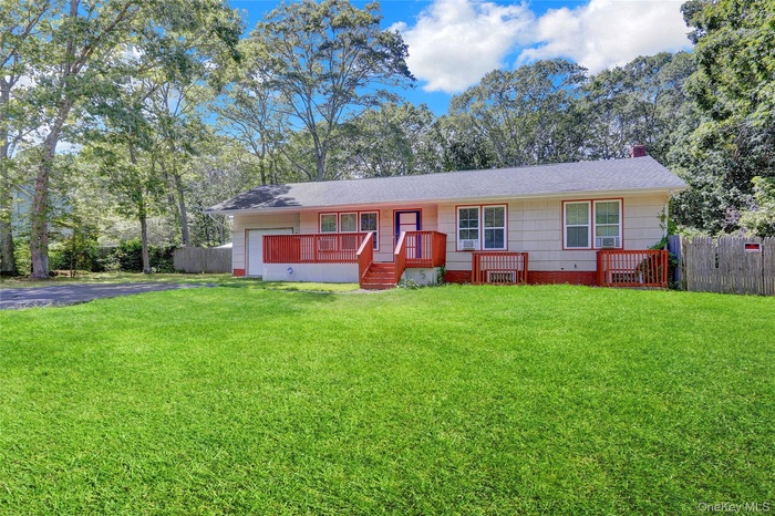 Single story home with crawl space, a chimney, covered porch, and view of scattered trees