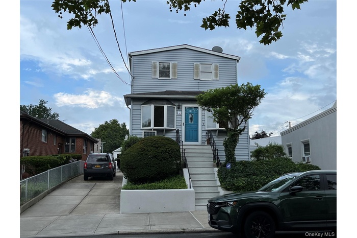 View of front of home featuring concrete driveway