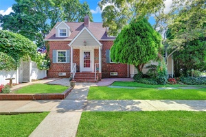 Set in a prime Merrick location, this 4 bedroom, 2 bathroom home blends classic charm and modern updates.