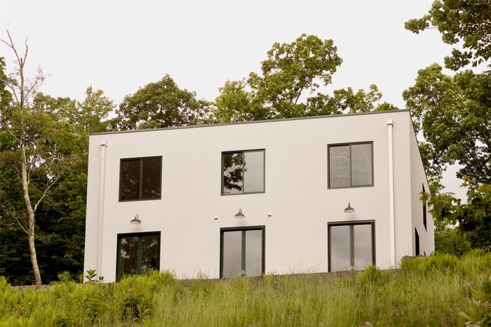 Back of house with stucco siding