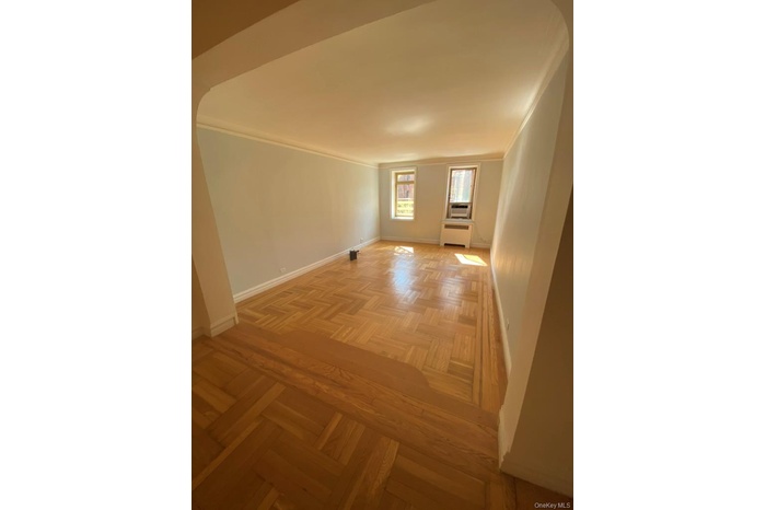 Corridor with ornamental molding and radiator heating unit