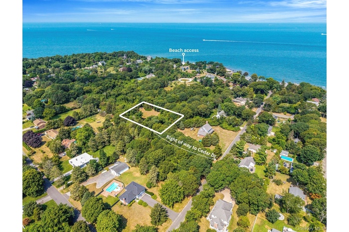 Aerial view of property's location with property boundaries highlighted and a nearby body of water