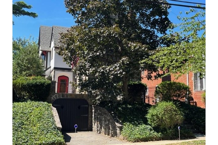 View of front of home featuring stucco, brick and siding