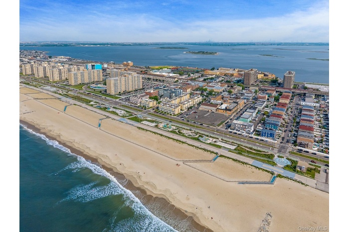 View of urban area featuring expansive beach