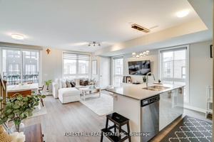 Absolutely stunning upper level two bedroom, three bathroom stacked townhome in the sought after Dempsey neighborhood.