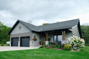Set on 50 picturesque acres along Island View Drive Grey Rd 1, this property offers a rare blend of natural beauty and modern living.