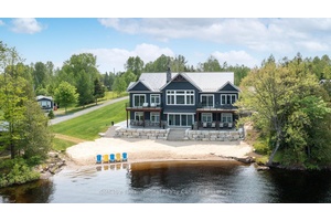 Welcome to 19 Bears Paw, a standout luxury cottage drenched in all day sun offering 175 feet of clean, sandy shoreline on sought after Whitestone Lake.