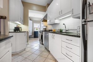Magnificent, stately 5, 500 square foot Victorian style, all brick, 3 storey Triplex which includes a separate 52 x 116 foot vacant development lot.