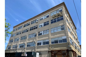 Prime Greenpoint Coomercial Condo with Sunlit Loft Space and Large Outdoor Private Patio for Sale.