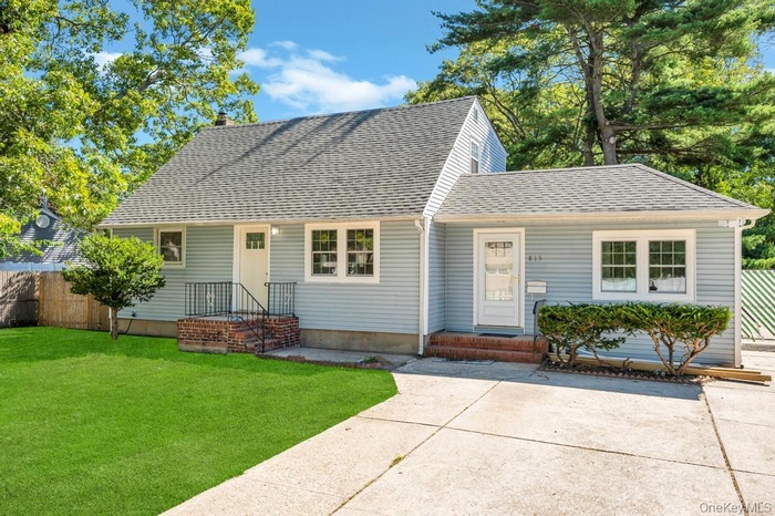 View of front of house featuring roof with shingles
