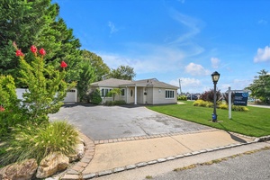 Welcome to this immaculate corner ranch home with water view, offering 3 generously sized bedrooms and 2 renovated bathrooms in a bright, open layout.