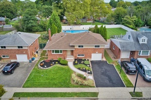 Beautifully renovated Split Level home in the Jericho school district, set on an oversized 60x163 lot in desirable Oakwood Princeton Park.