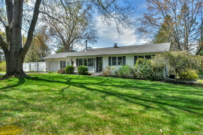 Curb appeal! Over an acre of level private property