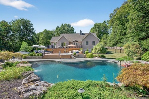 Welcome home to this exceptional 3 bedroom, 2 bath sprawling ranch set on 4 private acres in a truly idyllic setting.