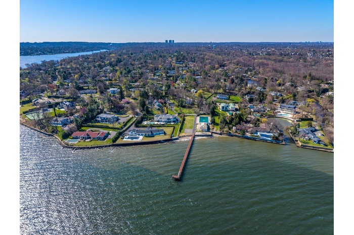 Drone / aerial view with a water view and a residential view