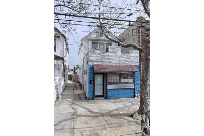 View of front of property featuring brick siding
