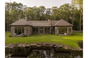 Welcome to Bucky s Pond. A long, private driveway lined with tall pines and mountain laurel leads you to this newly built home, sited on ten acres with a beautiful ...