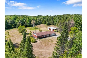 Situated on 4. 63 acres on a quiet, dead end street, this character filled bungalow offers an attached garage, a detached workshop, and a walkout basement with potential for in ...