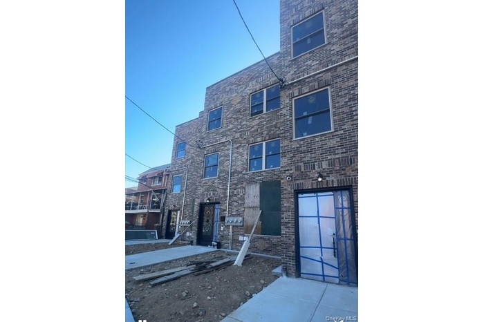 View of front of property with brick siding