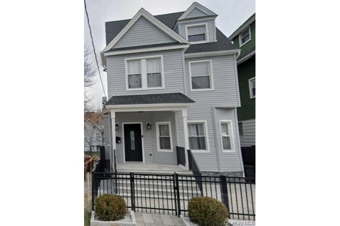 View of front of property with covered porch