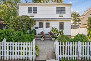 Location Location Legal 2 Family 2 Bedrooms 1 Bath each apartment, Hardwood Floors Gas heat, full Basement Lovely yard Drveway parking.