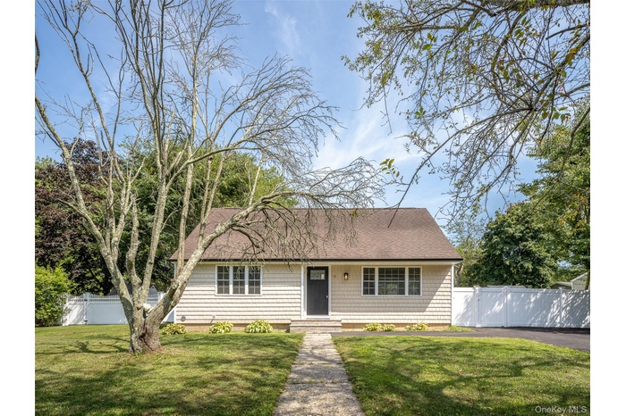 View of front of property featuring a shingled roof